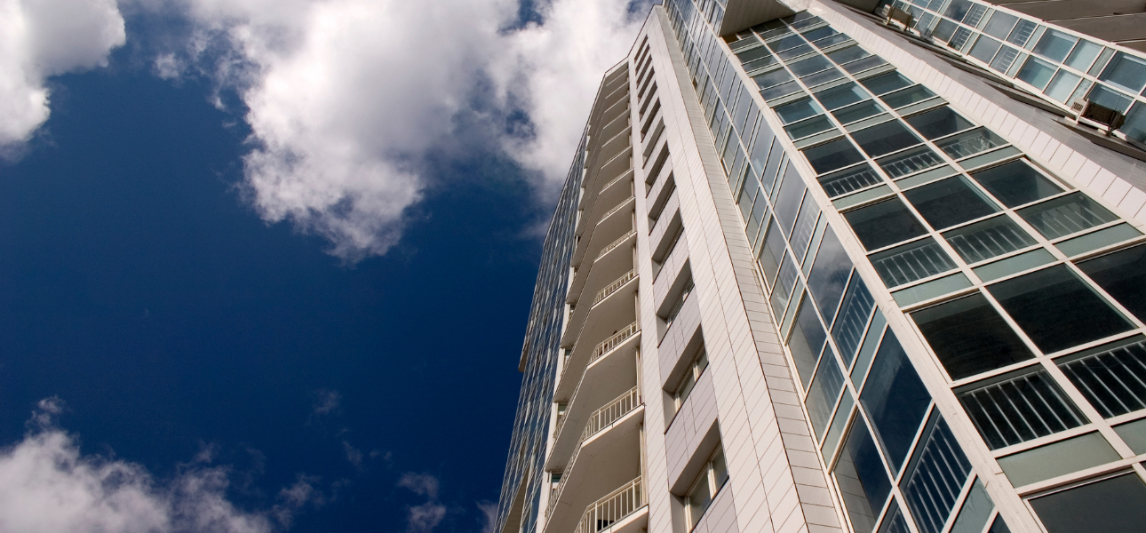 Modern high-rise condominium building with glass windows