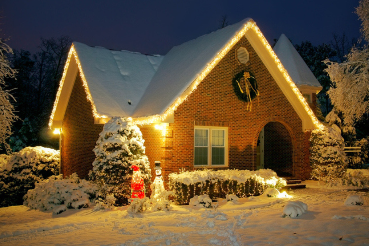 House decorated for Christmas in winter, showcasing holiday-themed exterior lights and decoration Group
