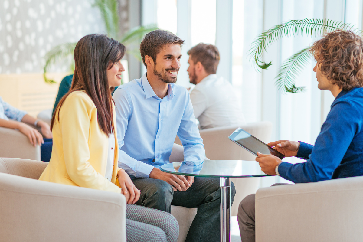 Newlywed couple reviewing life insurance options together.