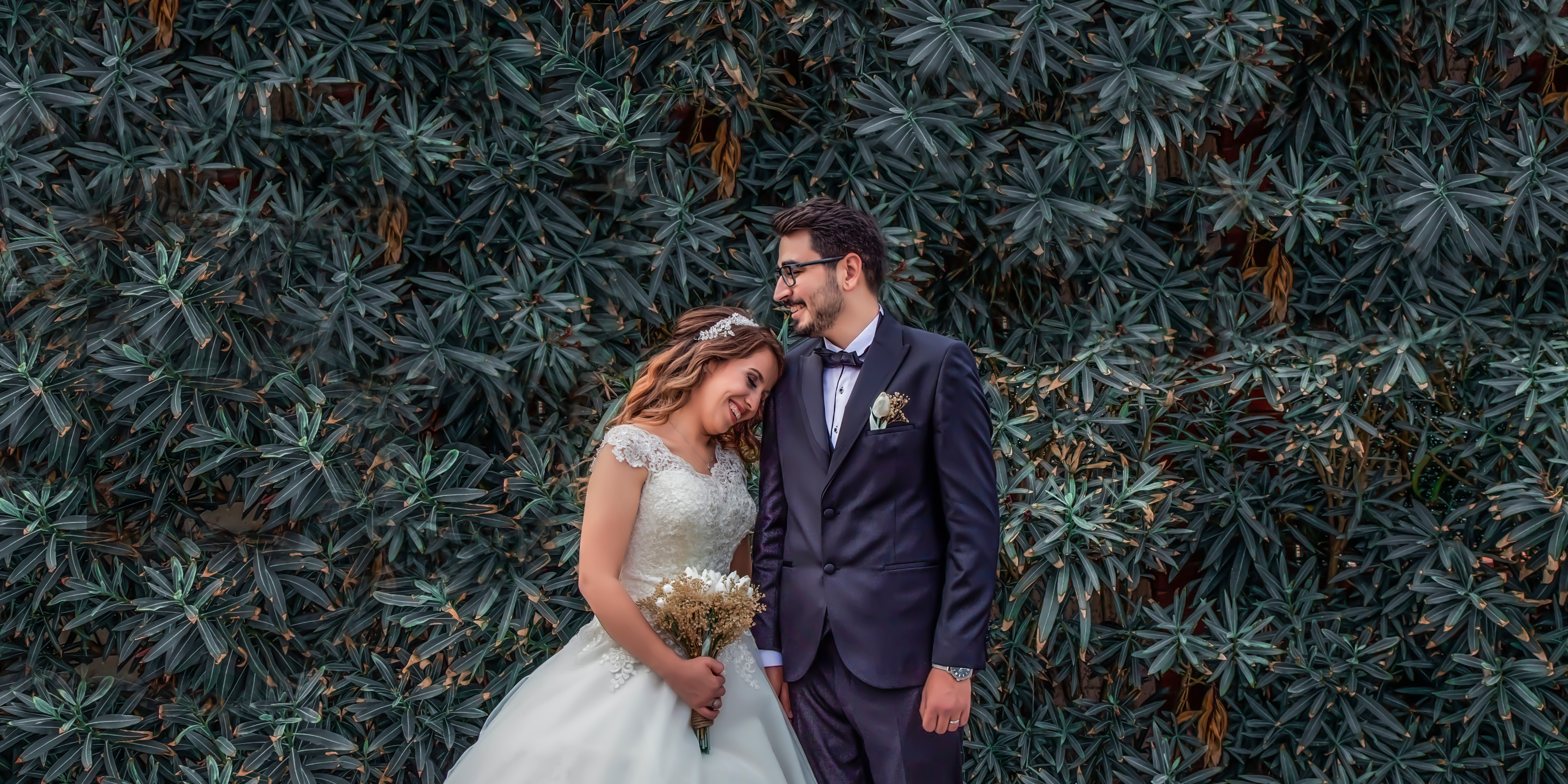 Bride smiling and relaxed, surrounded by wedding preparations, representing a stress-free wedding experience