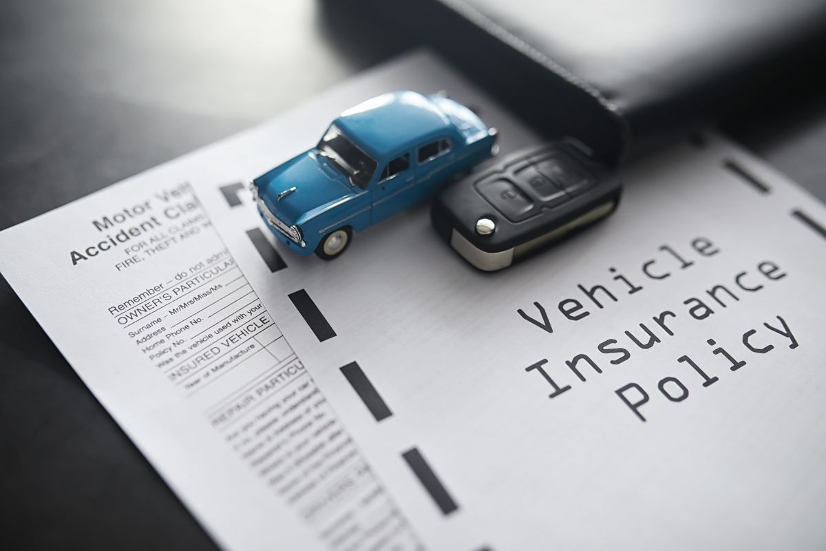 Close-up of a car insurance policy document.