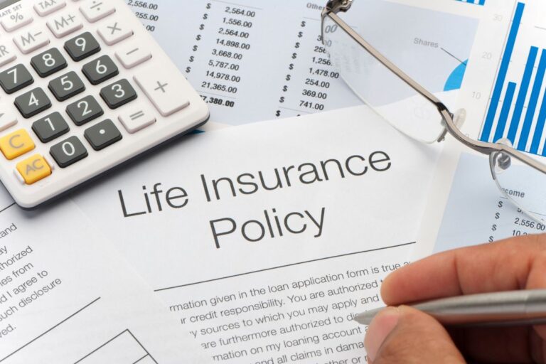 A smiling family sitting together on a couch, symbolizing love, protection, and the peace of mind life insurance provides.