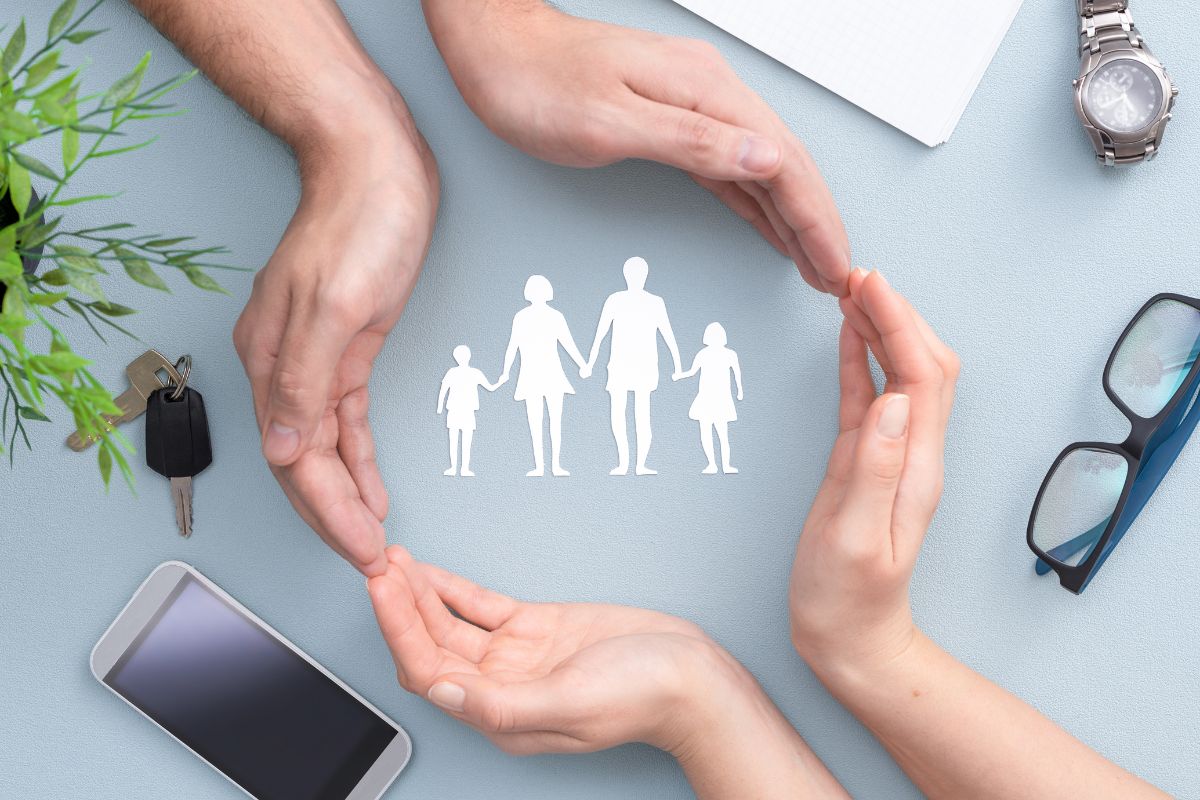 Happy family smiling together at home, symbolizing the protection life insurance provides for loved ones.