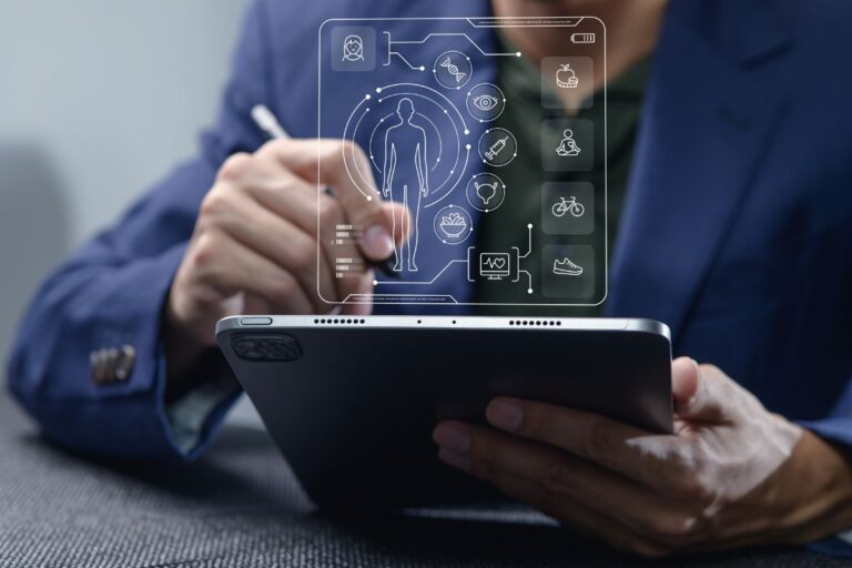 Person working on a laptop surrounded by floating digital app icons representing productivity and life-simplifying tools in 2026.