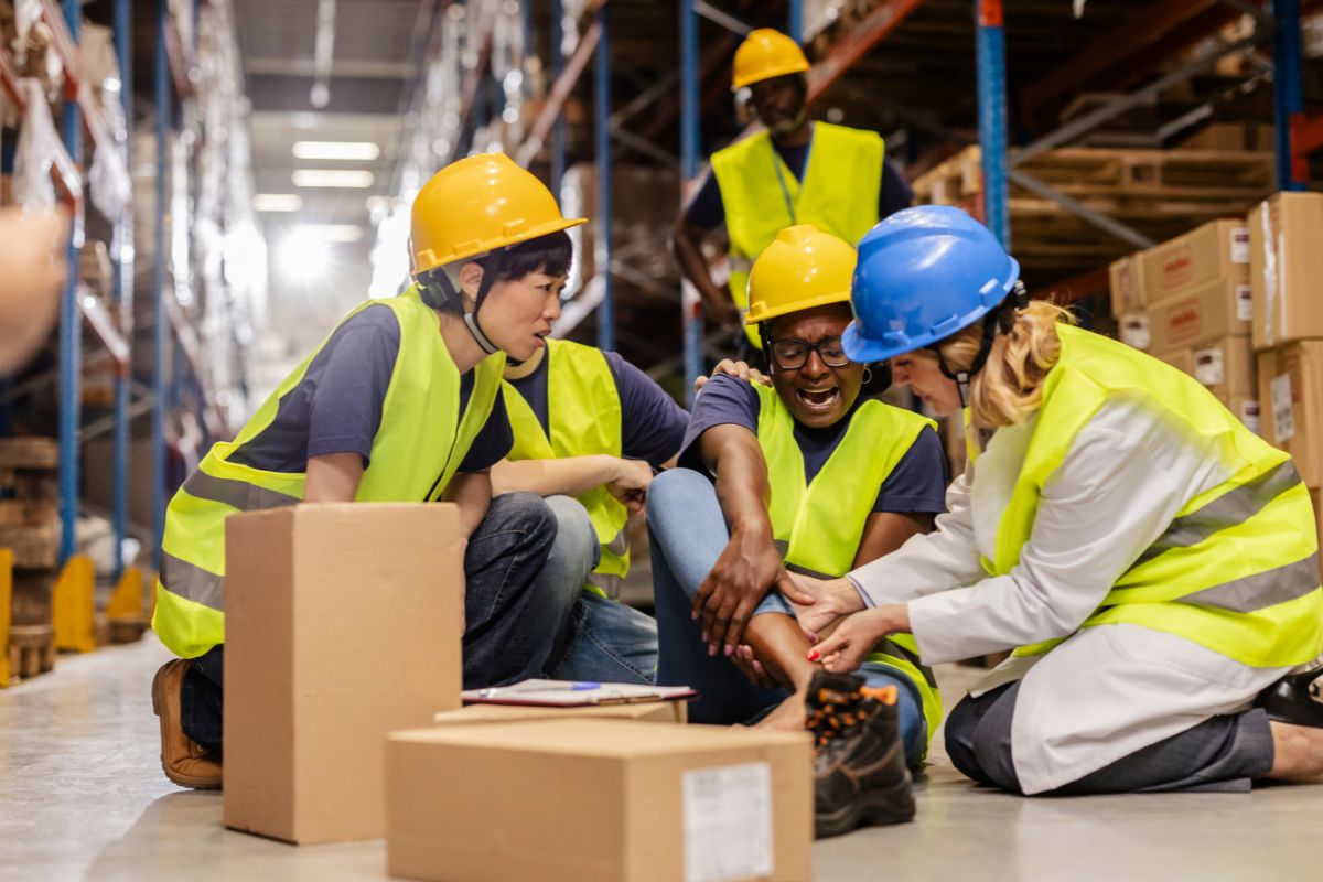 Office team reviewing workplace safety guidelines and workers’ compensation information