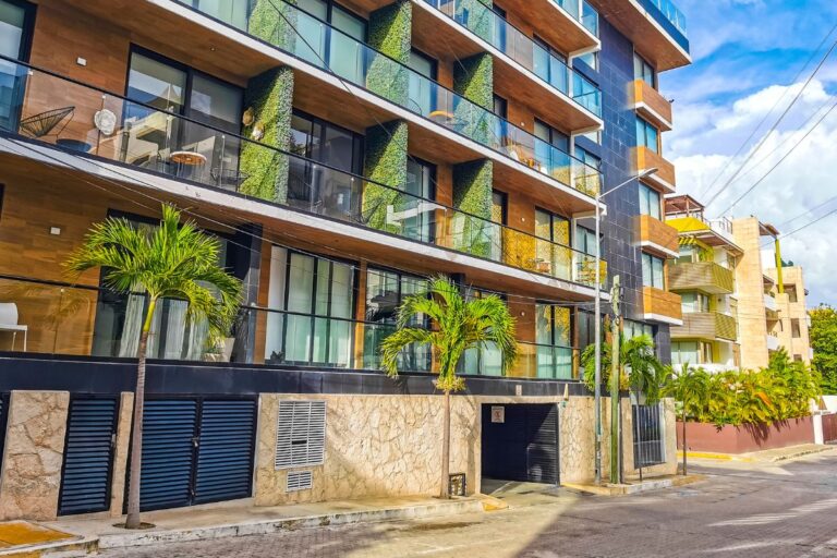 Landlord reviewing home insurance quotes and policy documents for a rental property