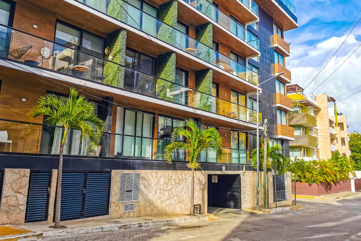 Landlord reviewing home insurance quotes and policy documents for a rental property