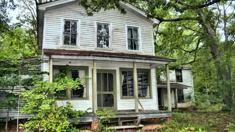 Vacant home with secured doors and windows to help prevent break-ins and property damage.